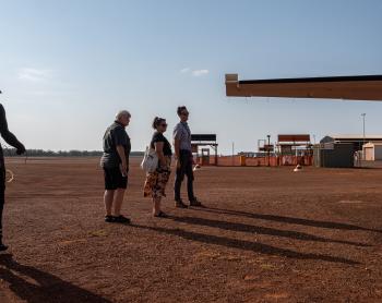 Pilot and pilots leaving plane on tarmac