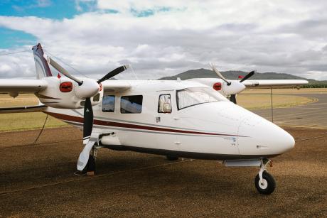 Twin engine aircraft on runway tarmac